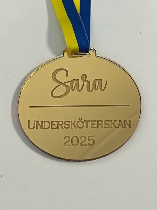 Skriv din egna text på medaljen